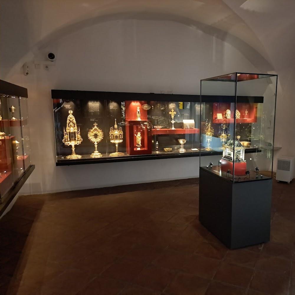 Gold artifacts in glass cases in a museum.